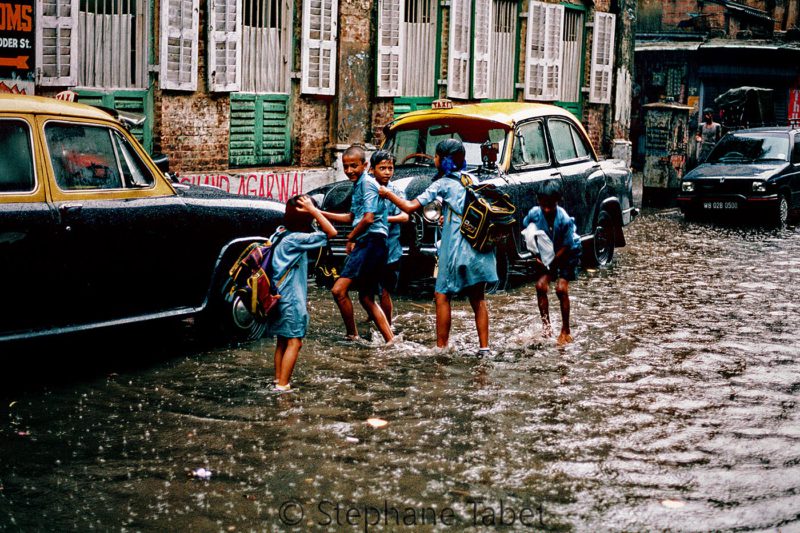best travel photographers, School children during monsoon Kolkata Calcutta India