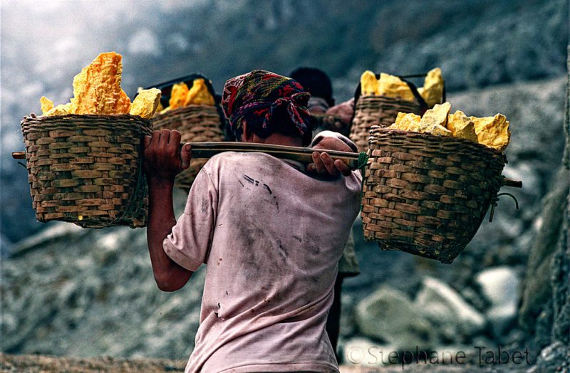 miner in volcano Kawah Ijen. Java, Indonesia.