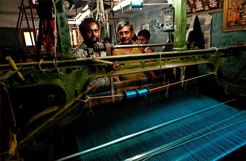 Indian men working at silk factory