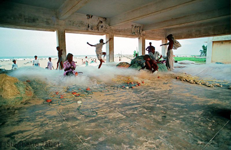 Fishermen and fishing net in India, Indian Ocean