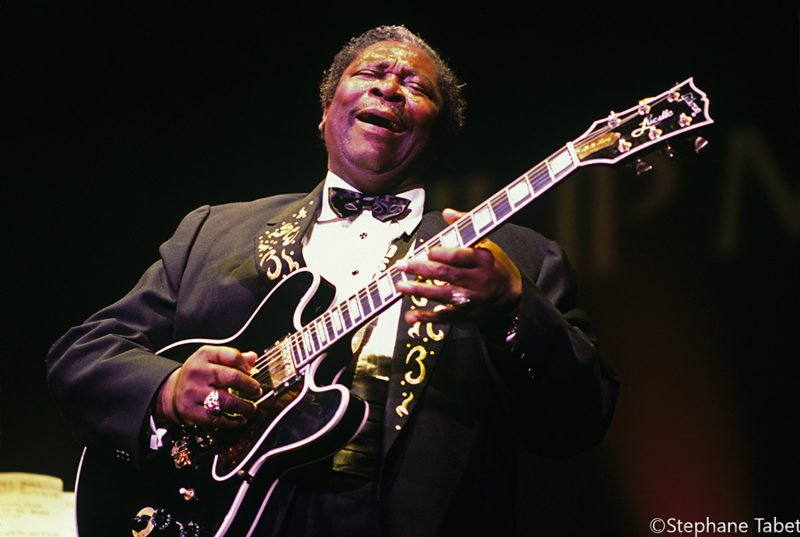 BB King playing guitar on stage