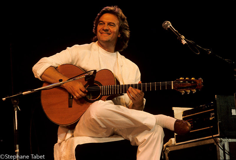 John McLaughlin playing guitar