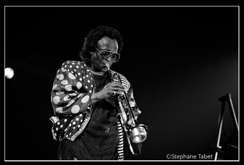 Miles Davis on stage eyes open