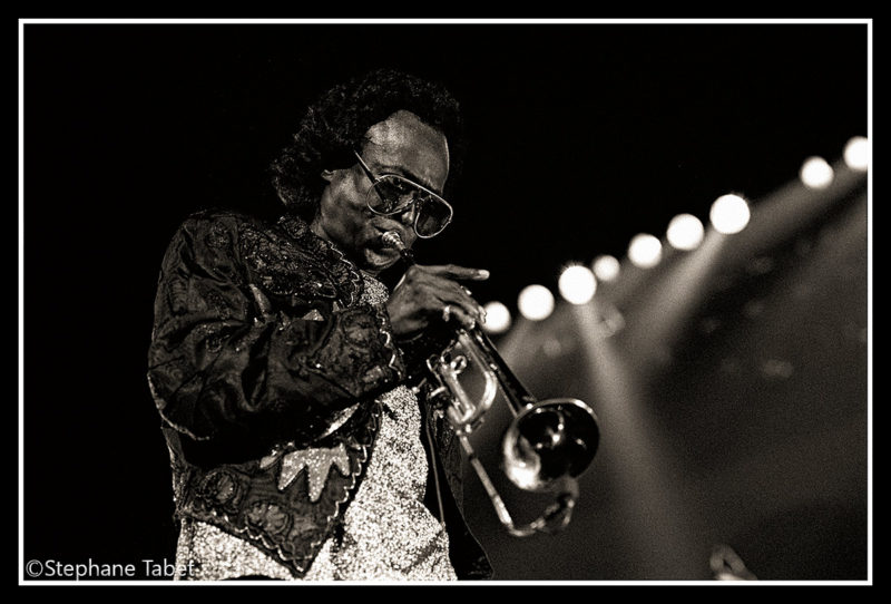 Miles Davis on stage performing eyes open