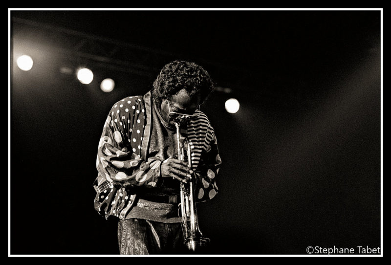 Miles Davis performs with his trumpet