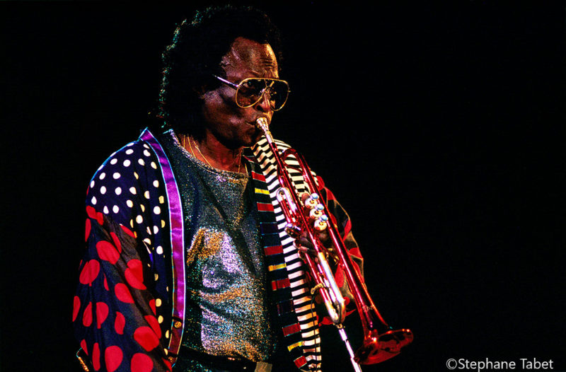 Miles Davis with his trumpet left hand